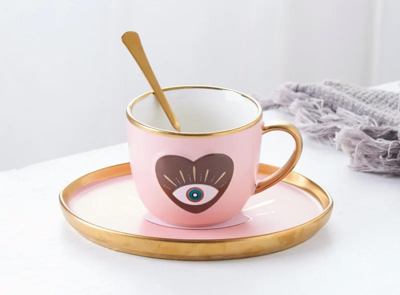 Evil Eye Coffee Cub with a Plate and Spoon
