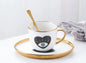 Evil Eye Coffee Cub with a Plate and Spoon